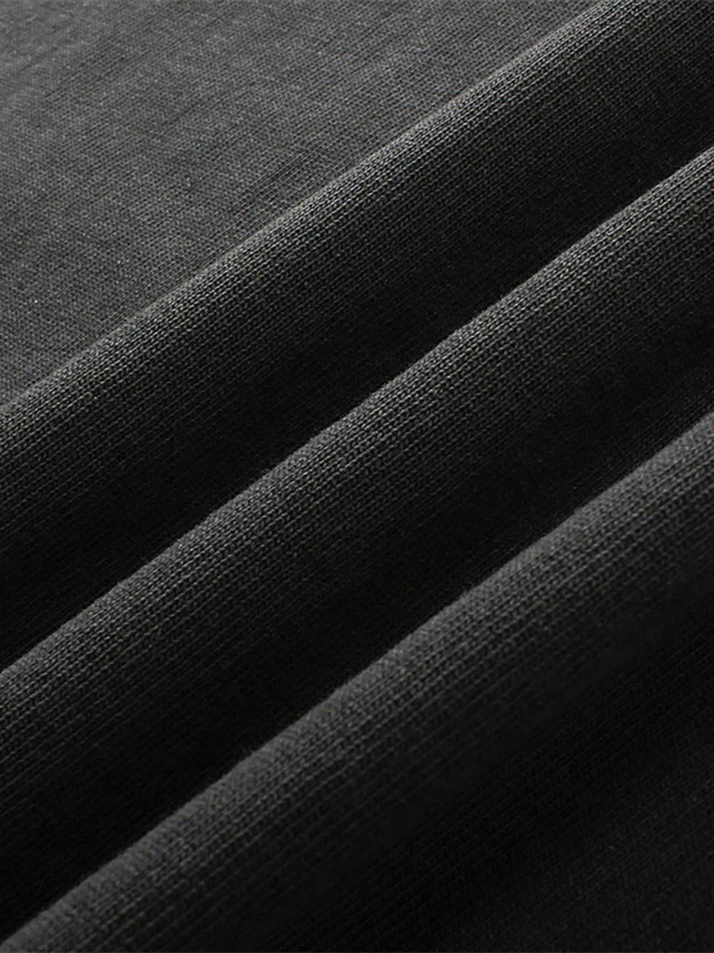 Close-up of black fabric with a textured pattern