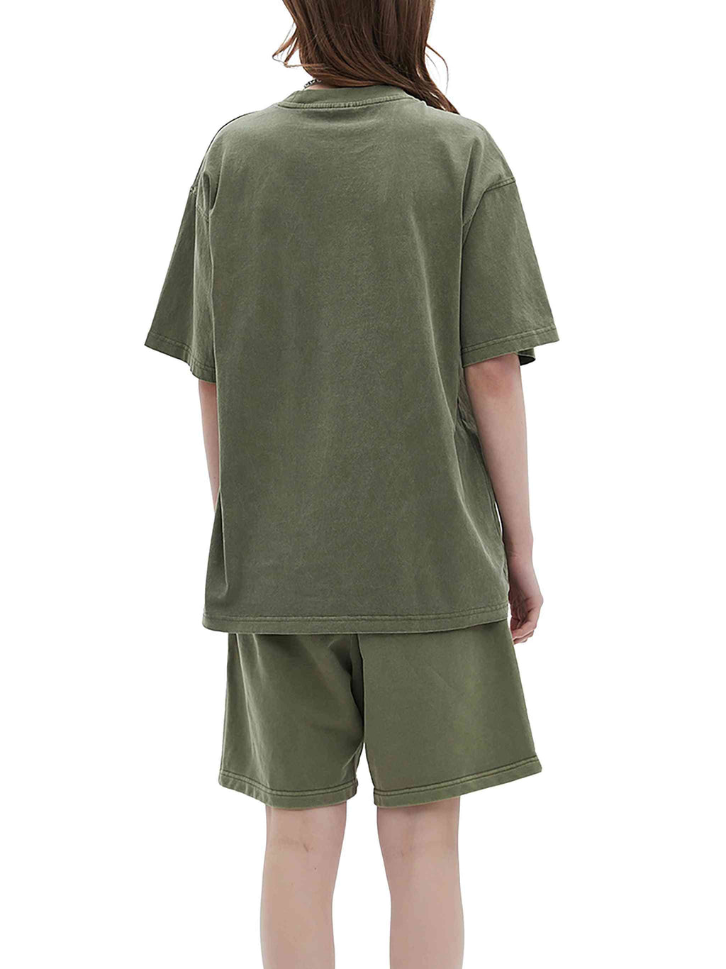 Person wearing a green t-shirt and shorts set on a white background