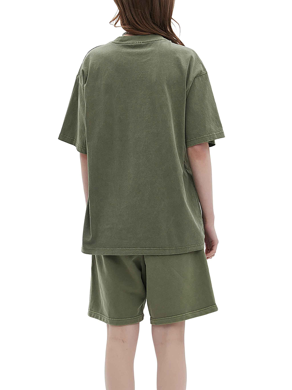Person wearing a green t-shirt and shorts set on a white background