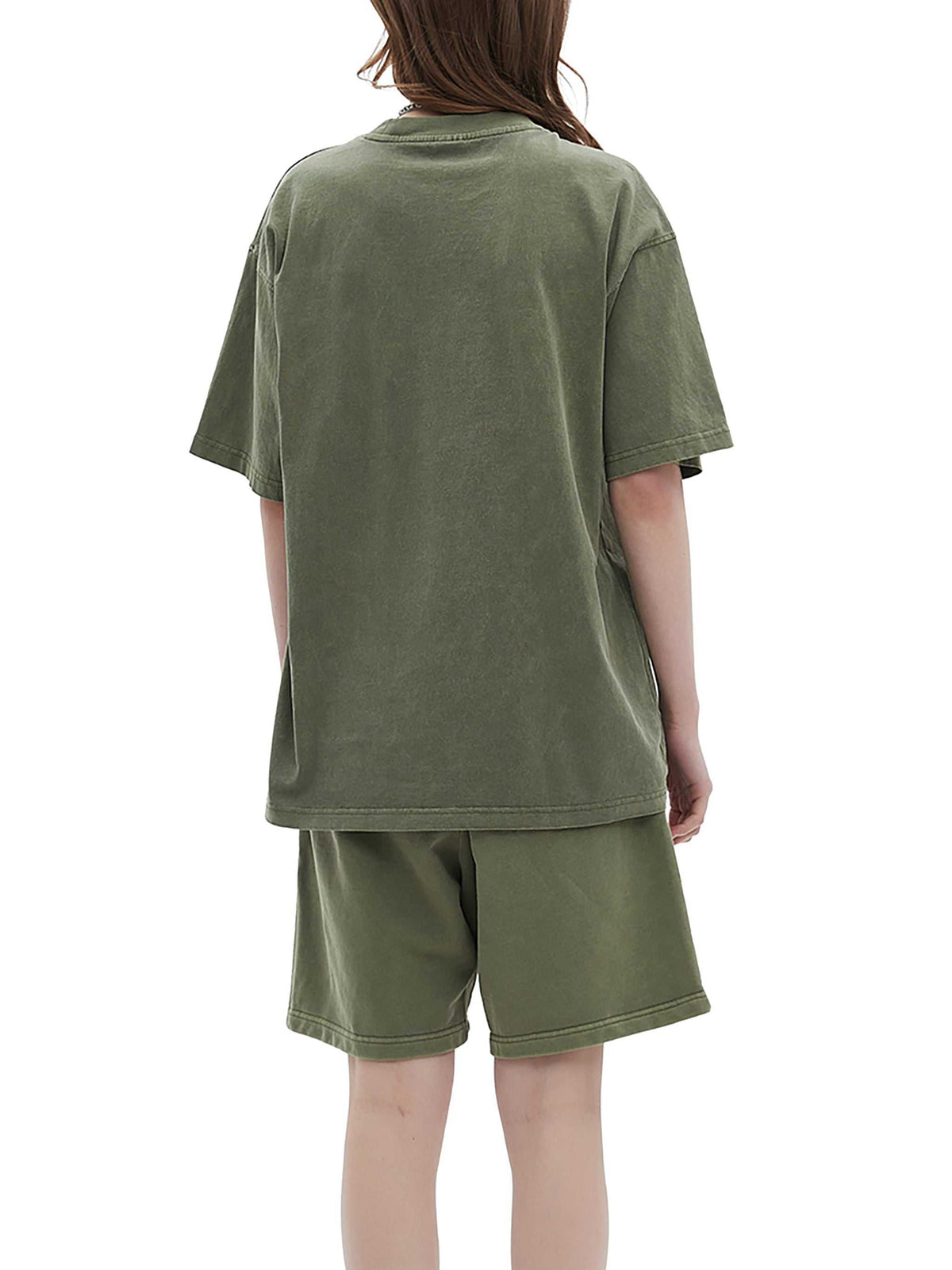 Person wearing a green t-shirt and shorts set on a white background