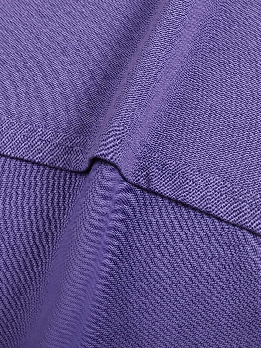 Close-up of a purple fabric texture