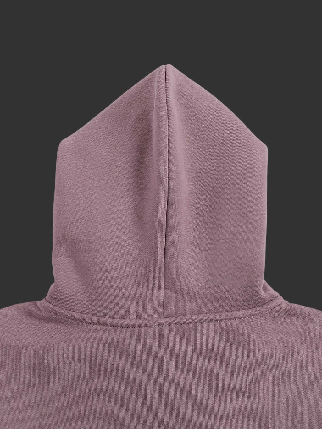 Close-up of a hooded garment in a solid color on a gray background