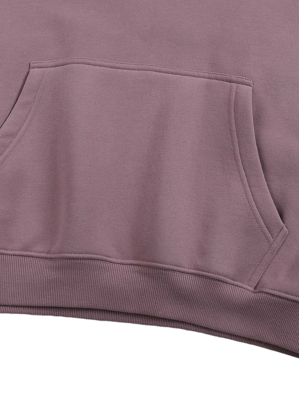 Close-up of a purple hoodie with a pocket on a white background