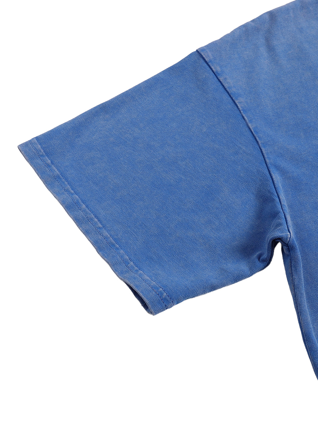 Close-up of a blue t-shirt sleeve on a white background