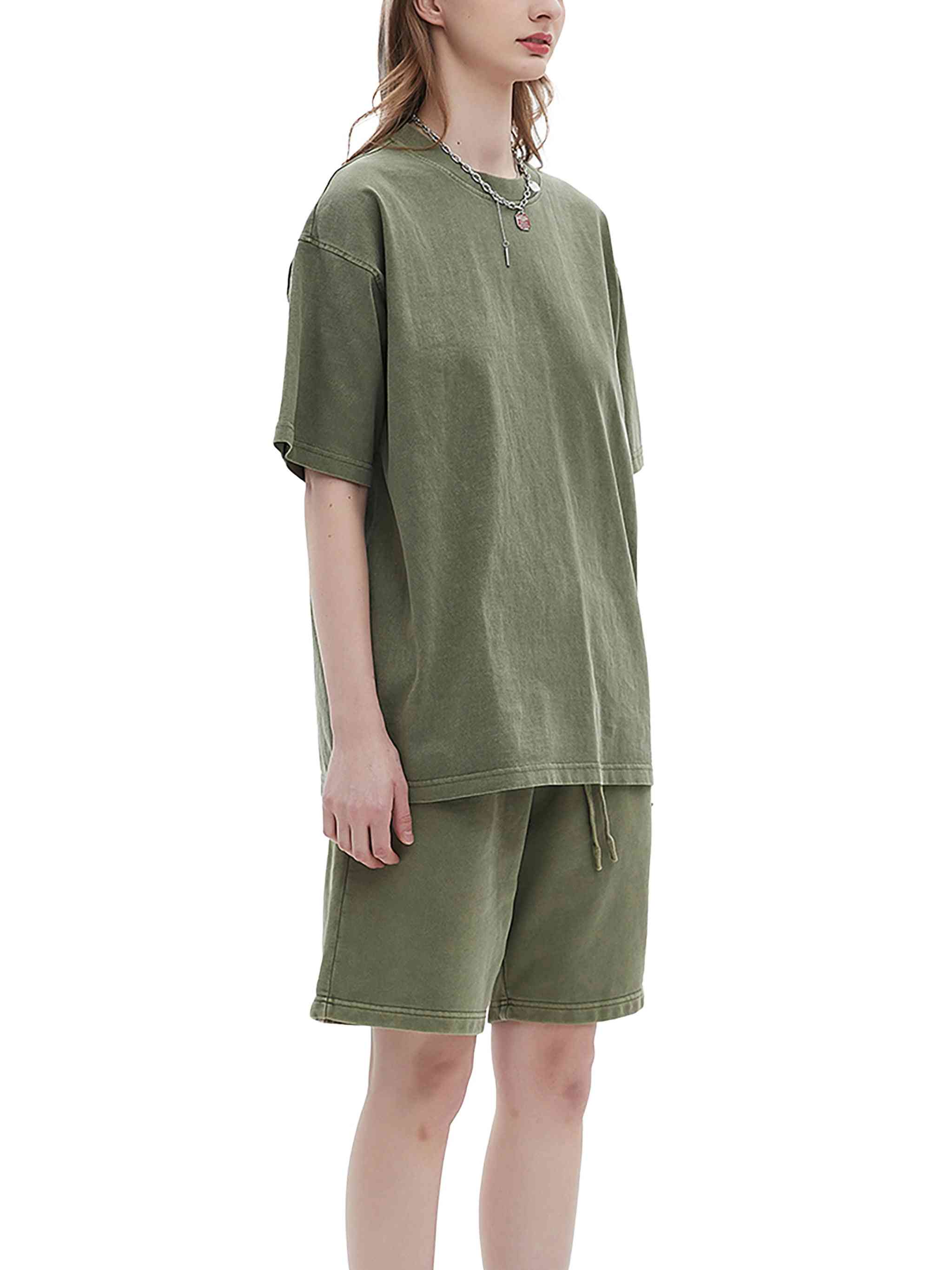 Person wearing an olive green outfit on a white background