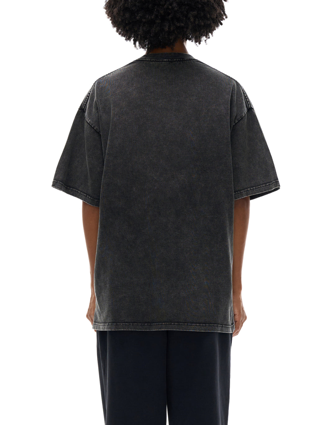 Person wearing a black t-shirt with a white background