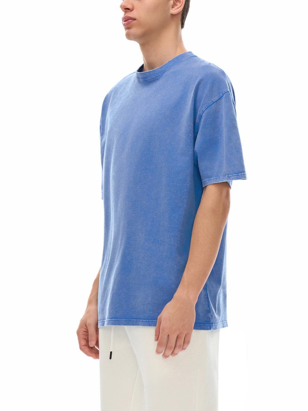 Person wearing a blue t-shirt on a white background