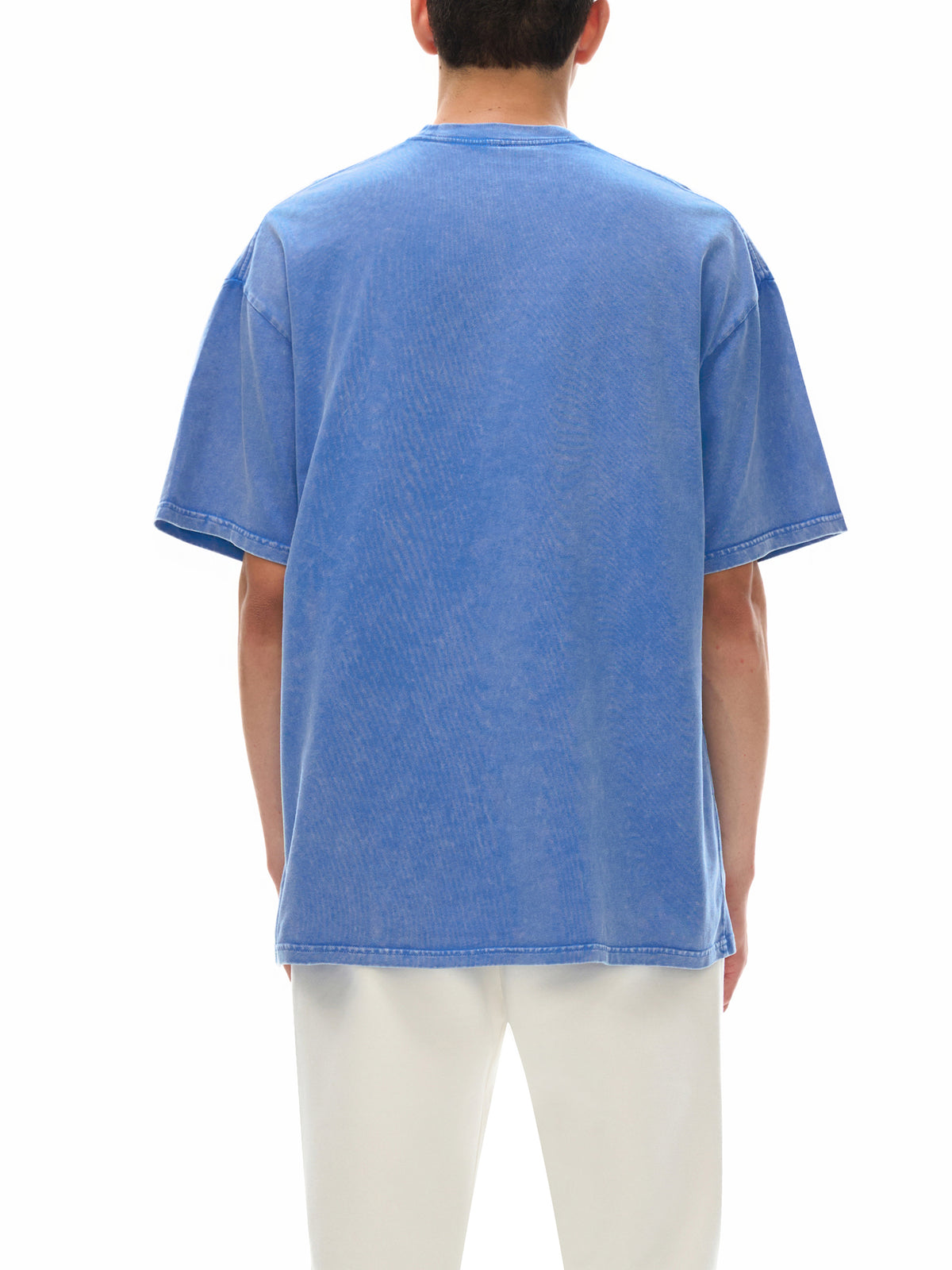 Person wearing a blue t-shirt on a white background