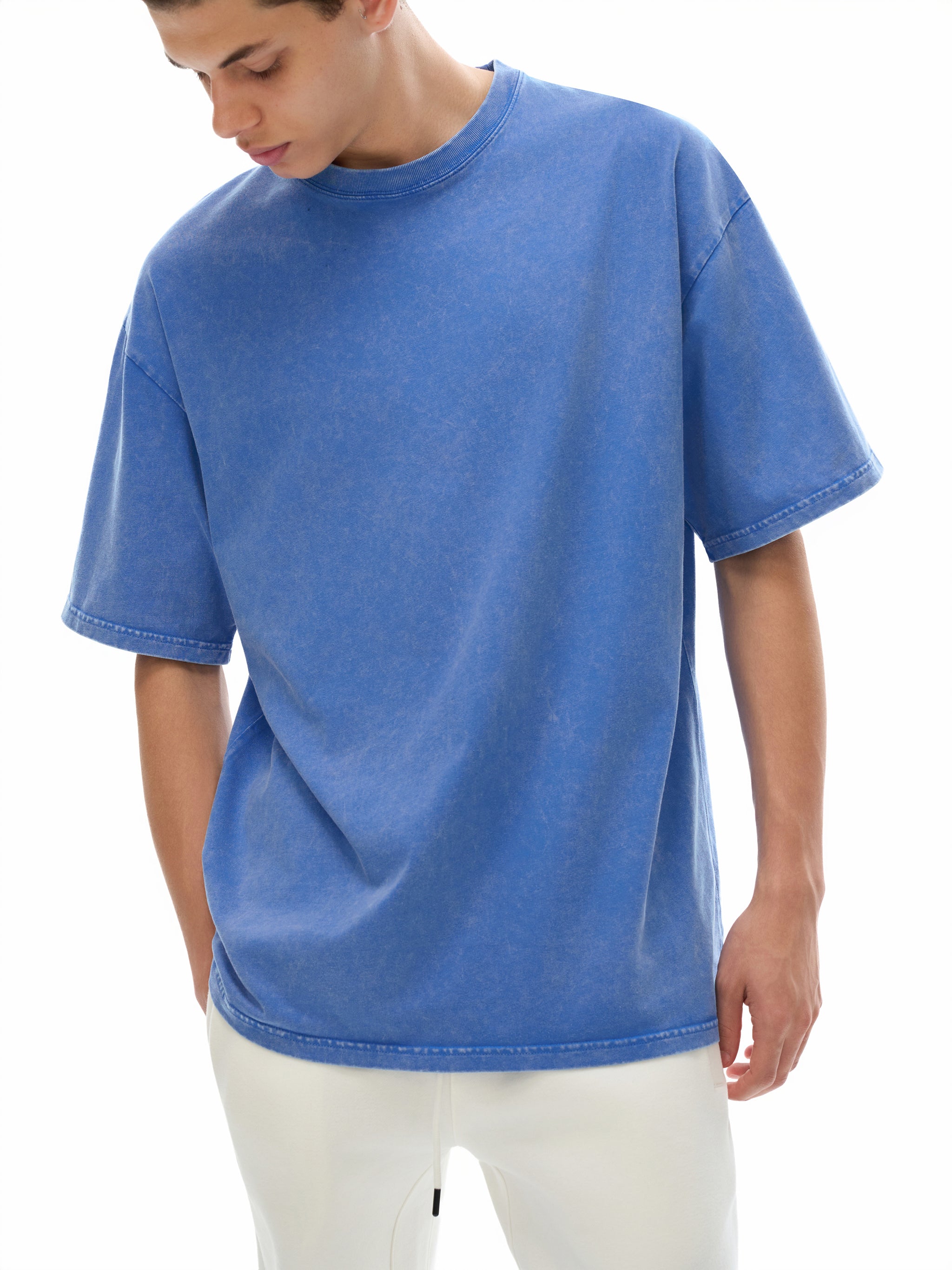 Person wearing a blue t-shirt on a white background