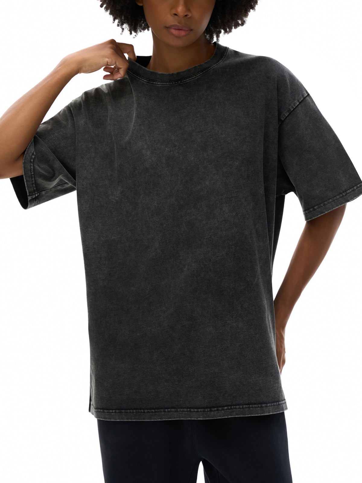 Person wearing a black t-shirt on a white background