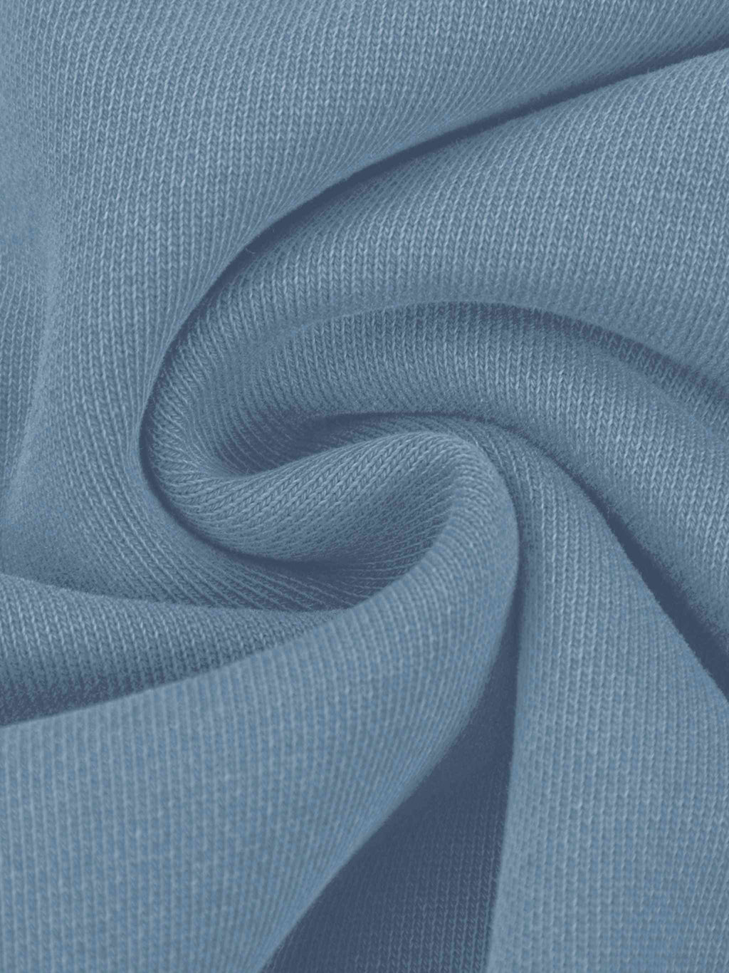 A close-up of light blue ribbed knit fabric, shown with soft folds and a smooth texture.